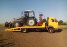 Фото перевозки спецтехники на эвакуаторе